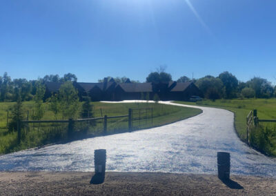 Applying new asphalt that leads to a private residence