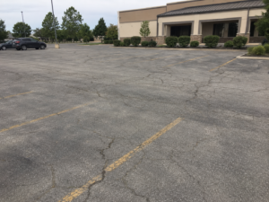 before parking lot asphalt maintenance